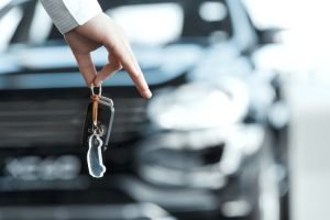 The key is held firmly in a hand.